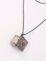 Daddys Little Slut necklace inside Black Gothic pendant engraved. A hidden message necklace for D/s dynamics, with dark romance and symbolism.