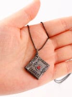 Daddys Little Slut necklace inside Black Gothic pendant engraved. A hidden message necklace for D/s dynamics, with dark romance and symbolism.