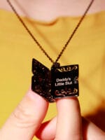 Daddys Little Slut necklace inside Black Gothic pendant engraved. A hidden message necklace for D/s dynamics, with dark romance and symbolism.