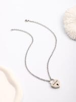 Lockable BDSM collar necklace with engraved heart pendant and matching key for submissive jewelry wear