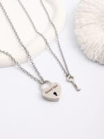 Lockable BDSM collar necklace with engraved heart pendant and matching key for submissive jewelry wear