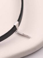 Discreet day collar with sterling silver pendant. A minimalist BDSM jewelry piece for daily submission. Subtle, elegant, and full of meaning.