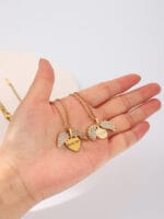 Gold hidden message necklace with sun or heart design engraved Good Girl