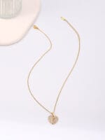 Gold hidden message necklace with sun or heart design engraved Good Girl