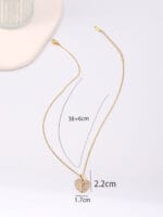 Gold hidden message necklace with sun or heart design engraved Good Girl