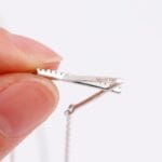 Hidden message necklace within Sterling silver submissive necklace with V design and hidden Good Girl message. A discreet day collar.