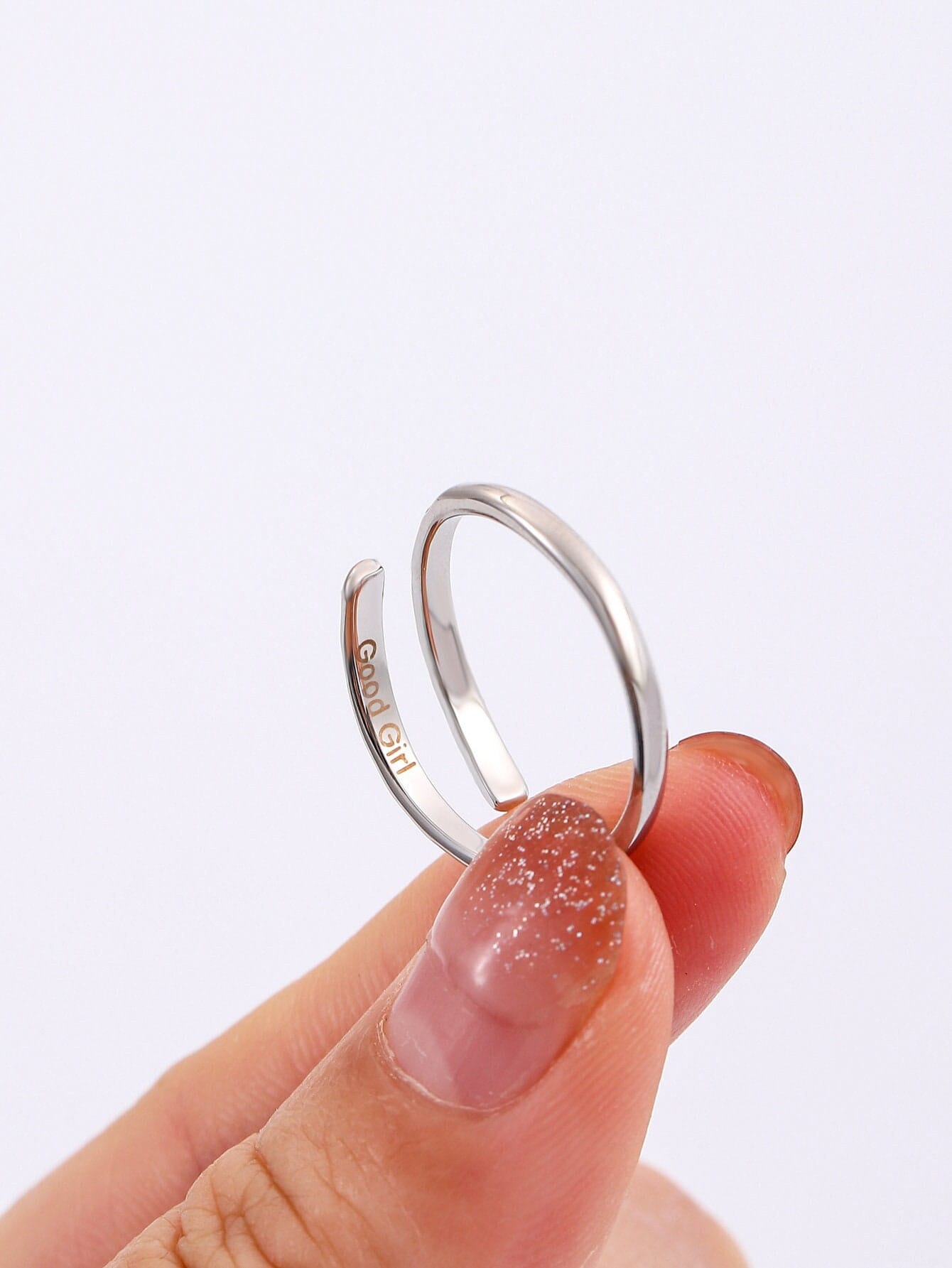 Sterling silver submissive ring with hidden Good Girl engraving — adjustable discreet BDSM jewelry for daily devotion and intimate submission.