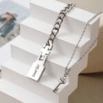 Permanent locking bracelet for submissive with engraved key and hidden message plate