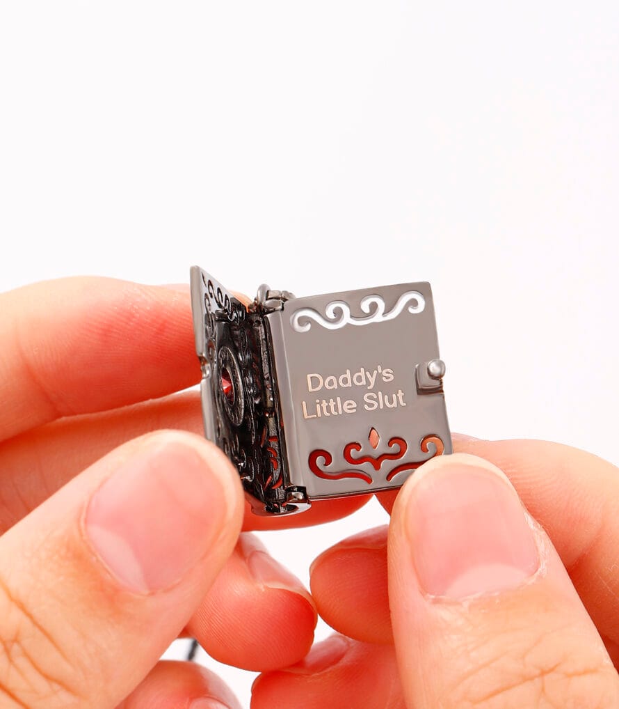 Daddys Little Slut necklace and the emotional symbolism . Discover contrast with Good Girl praise and the duality of submissive identity.