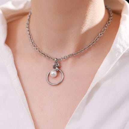 Stainless steel eternity collar necklace with pearl drop on submissive neck