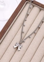 Permanent locking collar – stainless steel BDSM jewelry with bow pendant