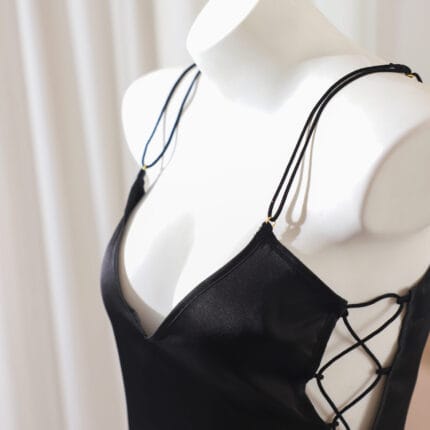 Black submissive slave outfit with lace-up sides and plunging neckline – kajira dress for D/s rituals