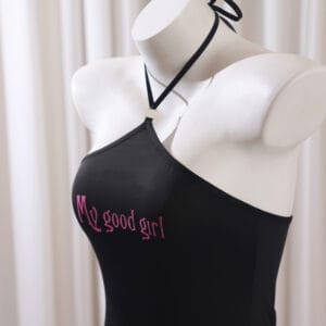 Collaring ceremony dress – black submissive gown with cut-out back and “My Good Girl” script for rituals.