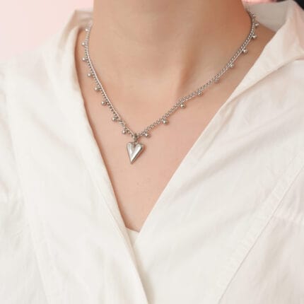 Heart collar necklace stainless steel with sculpted heart and bead station chain