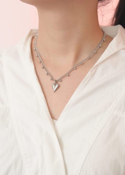 Heart collar necklace stainless steel with sculpted heart and bead station chain