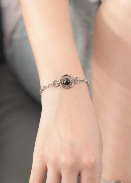 Triple O-ring submissive bracelet with black pearl and lockable hex lock