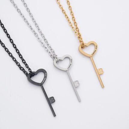 An engraved BDSM lock key in stainless steel, designed to open Classic Round and Flat Edge hex locks used in permanent locking collars.